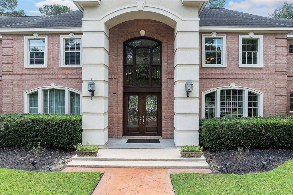 As you pull up to the home, you will come upon an inviting brick exterior with covered front porch area with arched stone walkway, stucco accents, coach lighting and mature landscaping! Gorgeous leaded glass double-doors offer entry to the home that we know you will surely fall in love with!