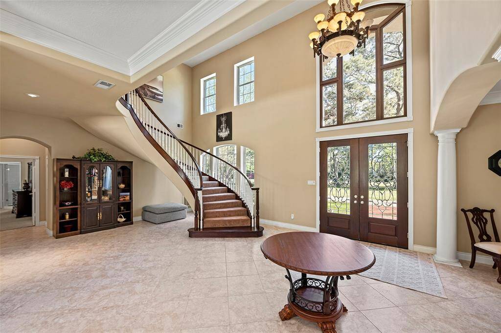 Architectural details from the double glass doors, arched window, arched walkways and columns, creates a timeless detail you will never tire of!