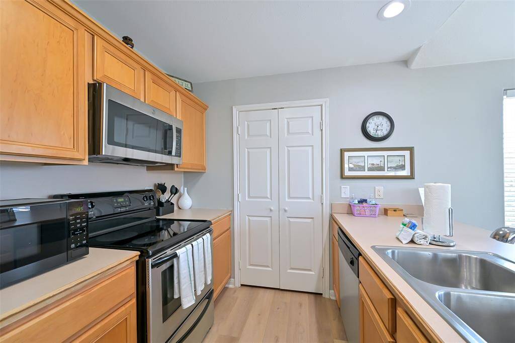 Spacious kitchen with stainless steel appliances.