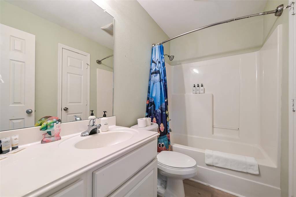Second bathroom with tub/shower combo.