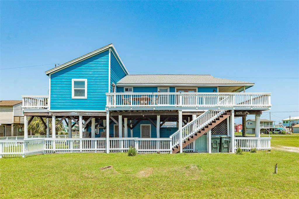 Front of home with lots of outdoor space on ground level and upper level.