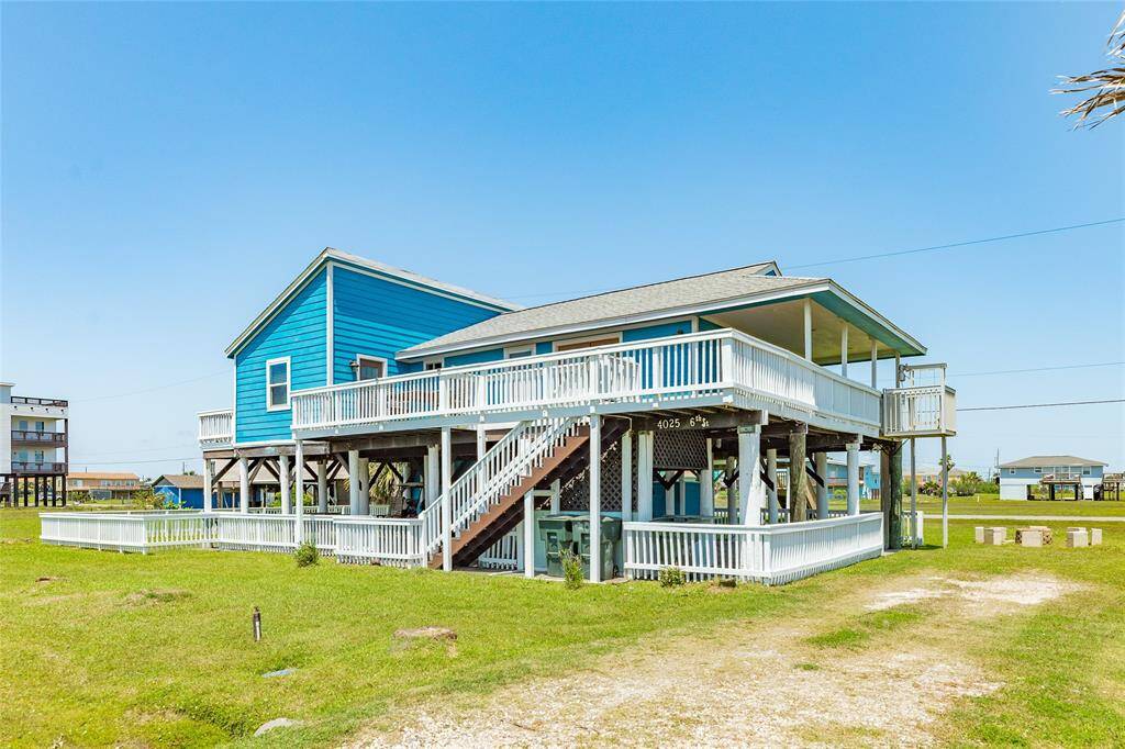 Side view of home with covered deck and lift for unloading and loading your vehicle.