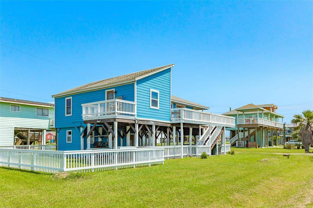 Fenced yard with deck off the primary bedroom facing the Bay.