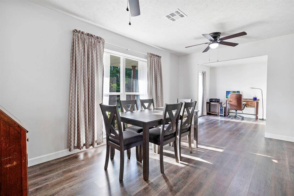 Dining area that leads to an office space w large windows provide plenty of natural light, and airy feel **403 E Lake Drive, Livingston, TX 77351**