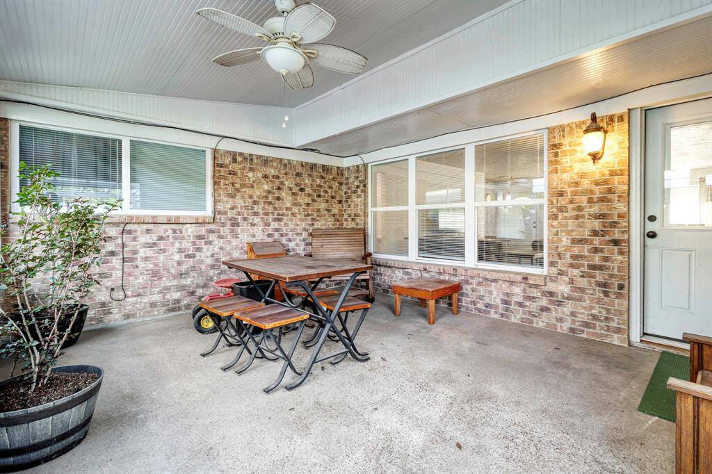 Another view of the Primary Bedroom showing the entrance as well as a wall that has ample space for a king-sized bed and seating area **403 E Lake Drive, Livingston, TX 77351**