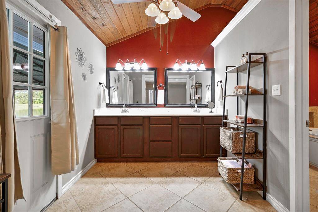The spacious layout, glass-enclosed shower, and natural light. Plus, enjoy the end of the day in your large jetted soaking tub **403 E Lake Drive, Livingston, TX 77351**