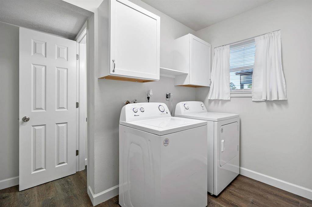 Bright and functional utility room with ample storage, washer and dryer included with home **403 E Lake Drive, Livingston, TX 77351**