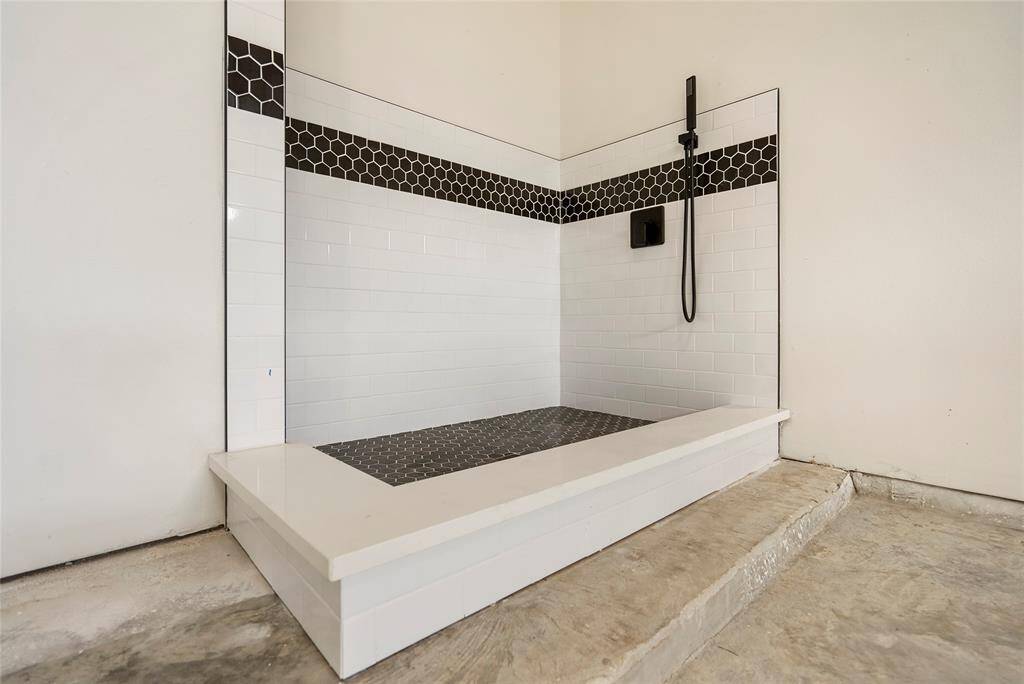 Designated Pet shower in oversized garage.