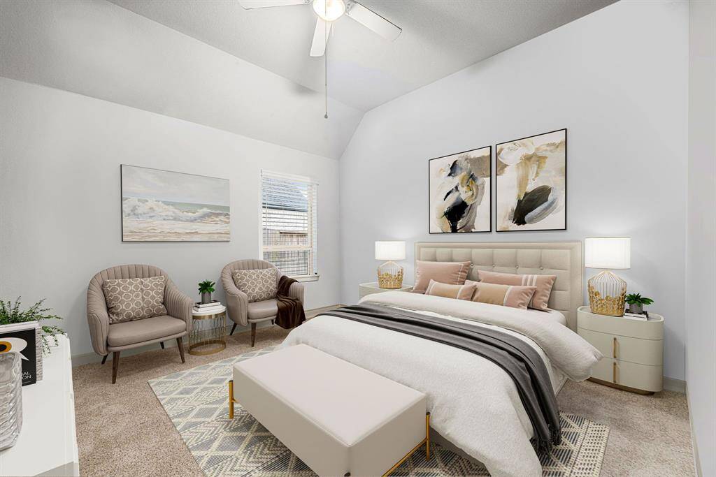 Secondary bedroom features plush carpet, neutral paint, ceiling fan with lighting and a large window with privacy blinds. *virtual staged*