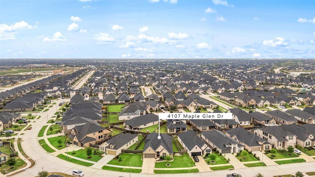 Amazing aerial shot of this gorgeous home situated on a quiet street in the sought after community of Cross Creek Ranch zoned to Lamar Consolidated ISD. Lush landscaping, well manicured front lawn and a wonderful back patio perfect to set up and an outdoor sitting area.