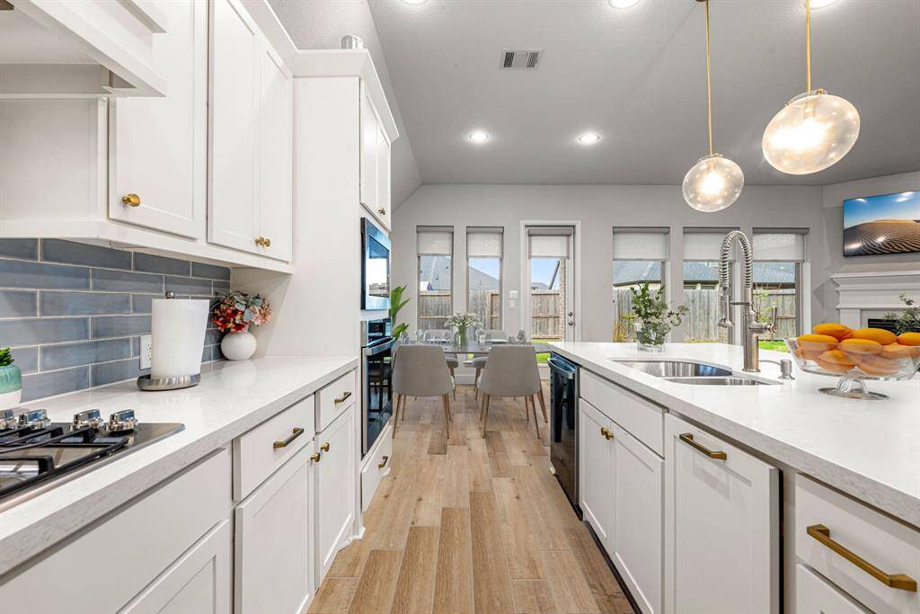 Any chef's dream, this stunning kitchen is perfect for everyday life as well as entertaining family and friends! Extra large kitchen island is perfect for conversation or that much needed space to lay out your party spread for everyone to enjoy! Large windows provide lovely views of your backyard and plenty of natural lighting throughout the day. *virtual staged*