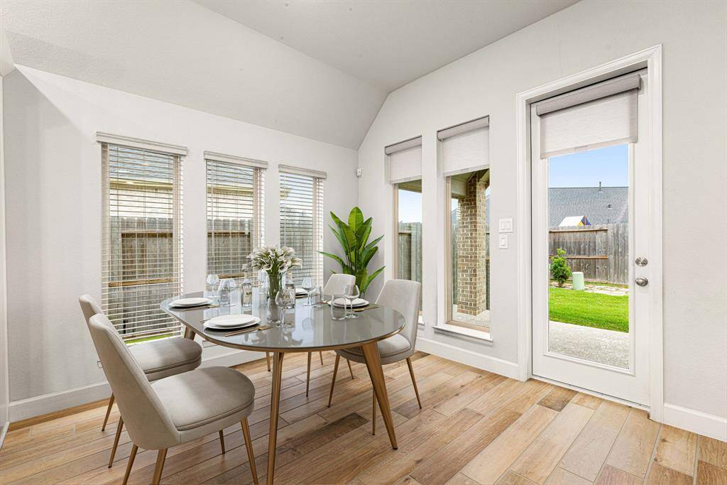 Start your day off right with a cup of coffee sitting with your family in the lovely breakfast area! Featuring large windows with blinds, neutral paint, wood like tile flooring and recessed lighting. *virtual staged*
