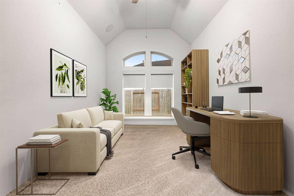 Nestled away quietly near the front of the home is the handsome and grand home office. Featuring high ceilings, ceiling fan, neutral paint, plush carpet flooring and large windows with privacy blinds. *virtual staged*