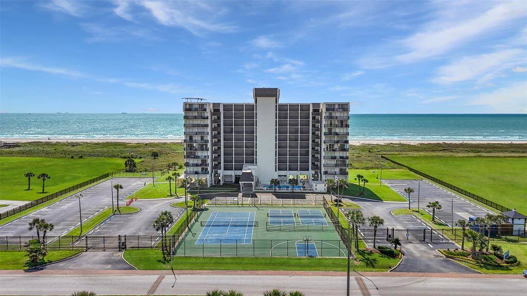 Islander East is a gated beachfront complex that offers beautifully maintained grounds, ample parking, and top-tier amenities including tennis and pickleball courts with a direct ocean backdrop.
