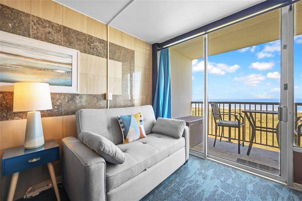Relax on the stylish new sleeper sofa just steps from the sliding doors that open to panoramic Gulf views. This space doubles perfectly for guests or lounging after a day on the beach.