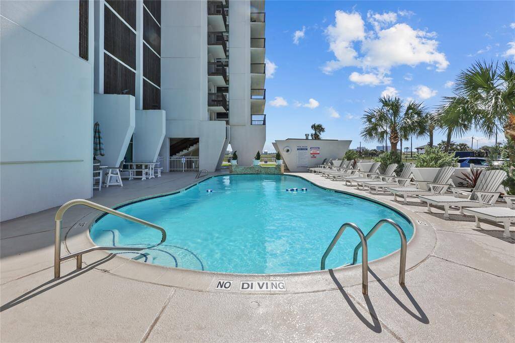 Enjoy a resort-style pool just steps from your door. Relax in the sun, take a refreshing dip, or unwind by the outdoor fireplace with the sound of waves nearby.