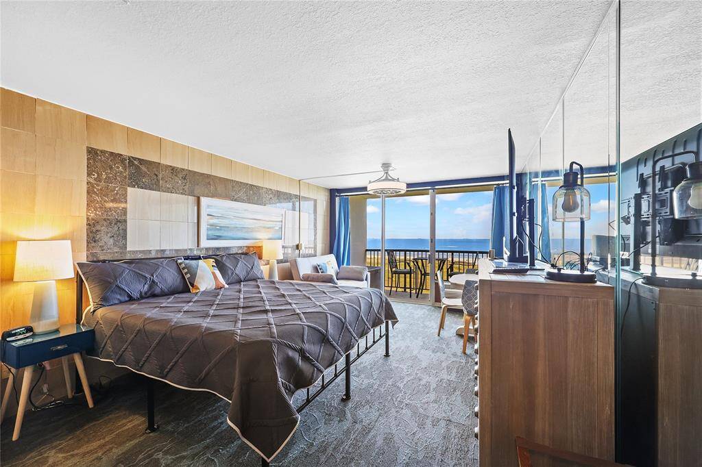 Wake up to breathtaking Gulf views from the comfort of your bed. The large windows and sliding doors let in natural light while connecting you seamlessly to the oceanfront balcony.