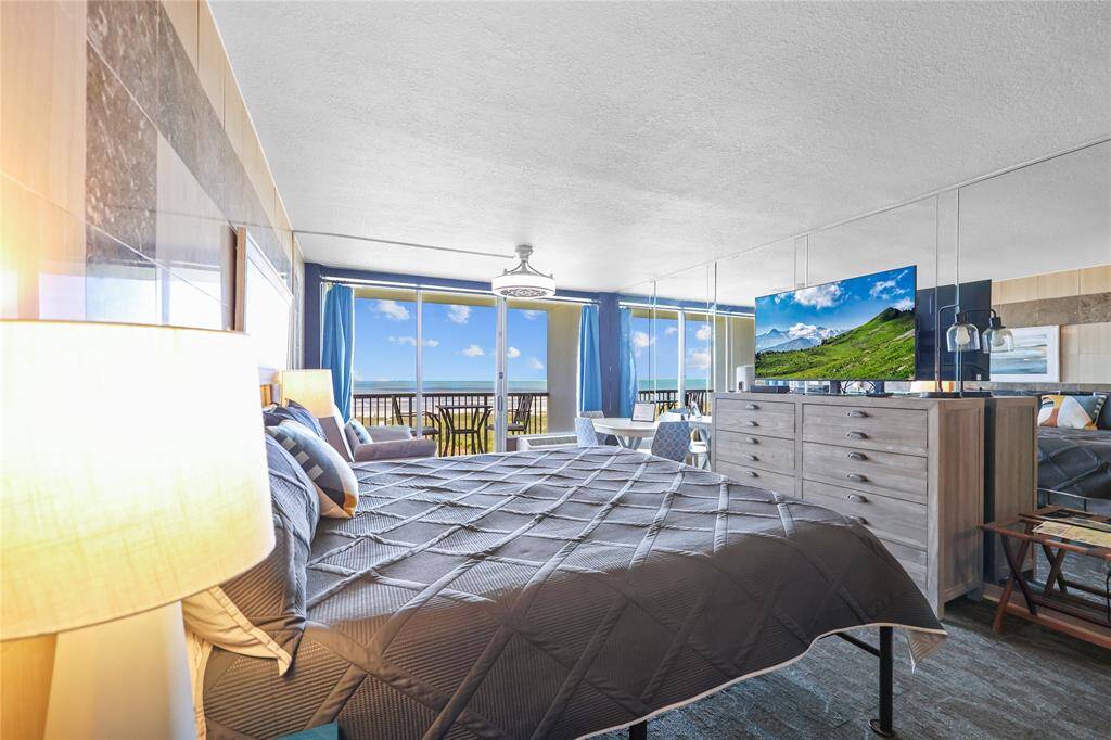 Spacious, bright, and inviting—the sleeping area flows beautifully into the living and dining space, with the balcony just steps away for fresh air and stunning scenery.
