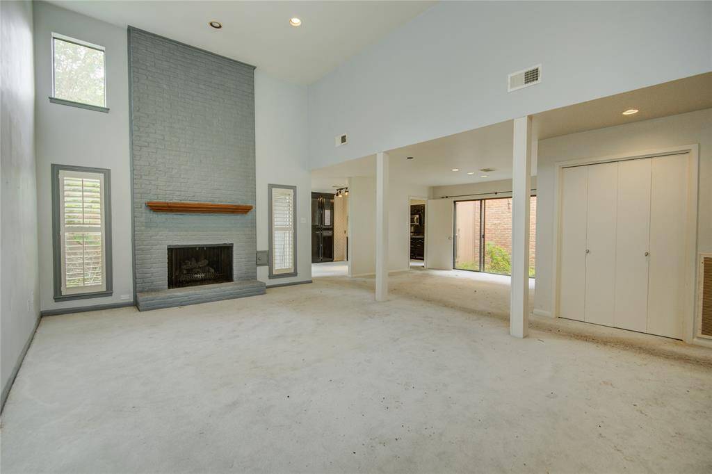 Incredible fireplace with lots of natural light in the living area