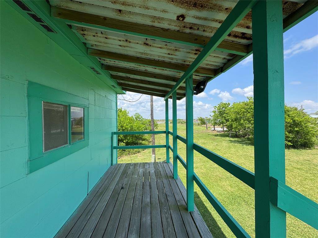 Unwind on the inviting patio and soak in the views of the expansive green yard and wide-open blue skies—perfect for enjoying peaceful mornings or relaxing evenings outdoors.