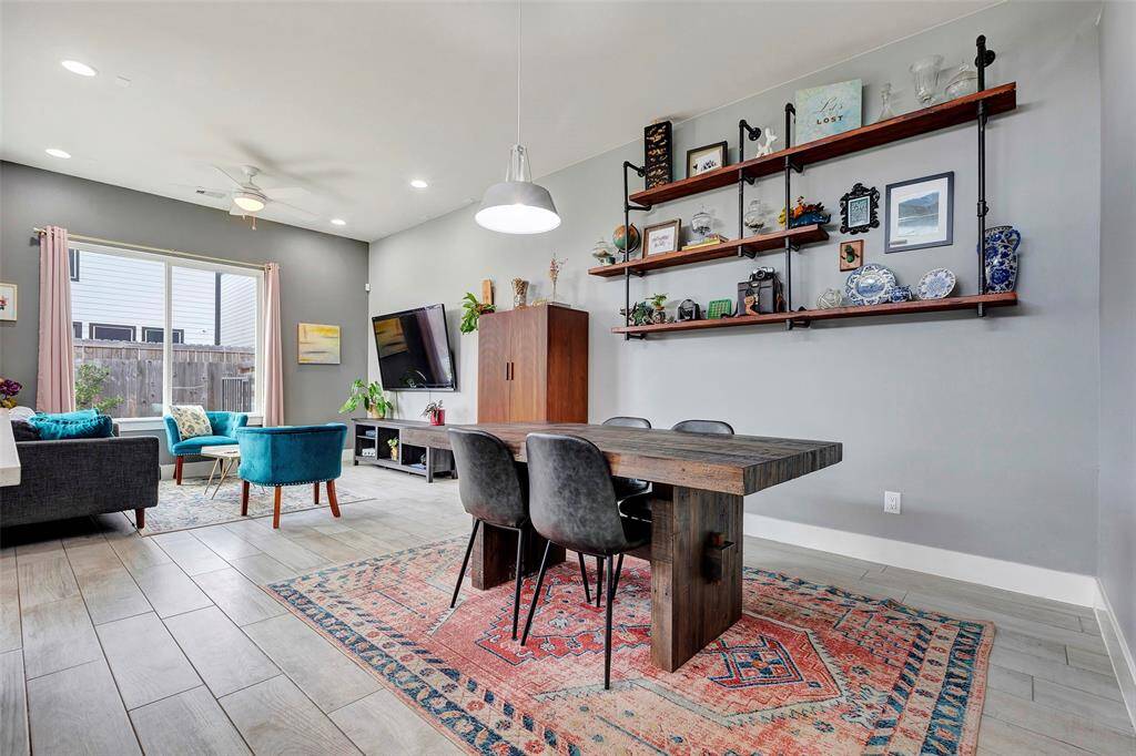 An open and airy space – enjoy seamless flow from the dining room to the cozy living room, perfect for entertaining and everyday comfort.