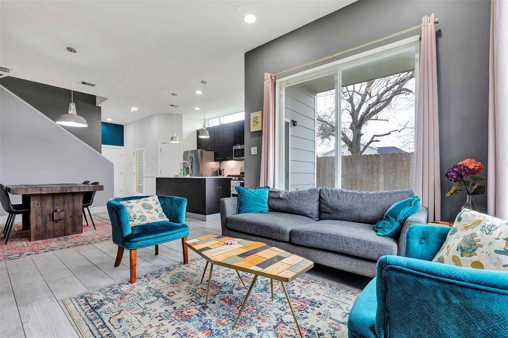 A seamless view from the living room to the kitchen and the staircase leading to the upper floor making the spaces open and connected.