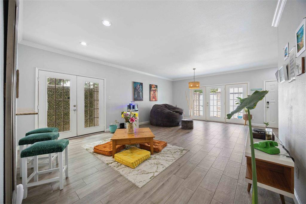 Spacious living/dining area with abundance of natural light.