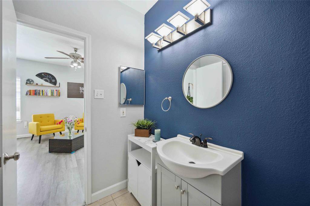 Secondary en-suite bathroom with tub/shower combo.
