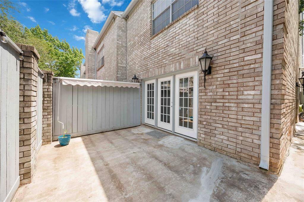 Fenced, private, wraparound patio with access from two sides of the home.