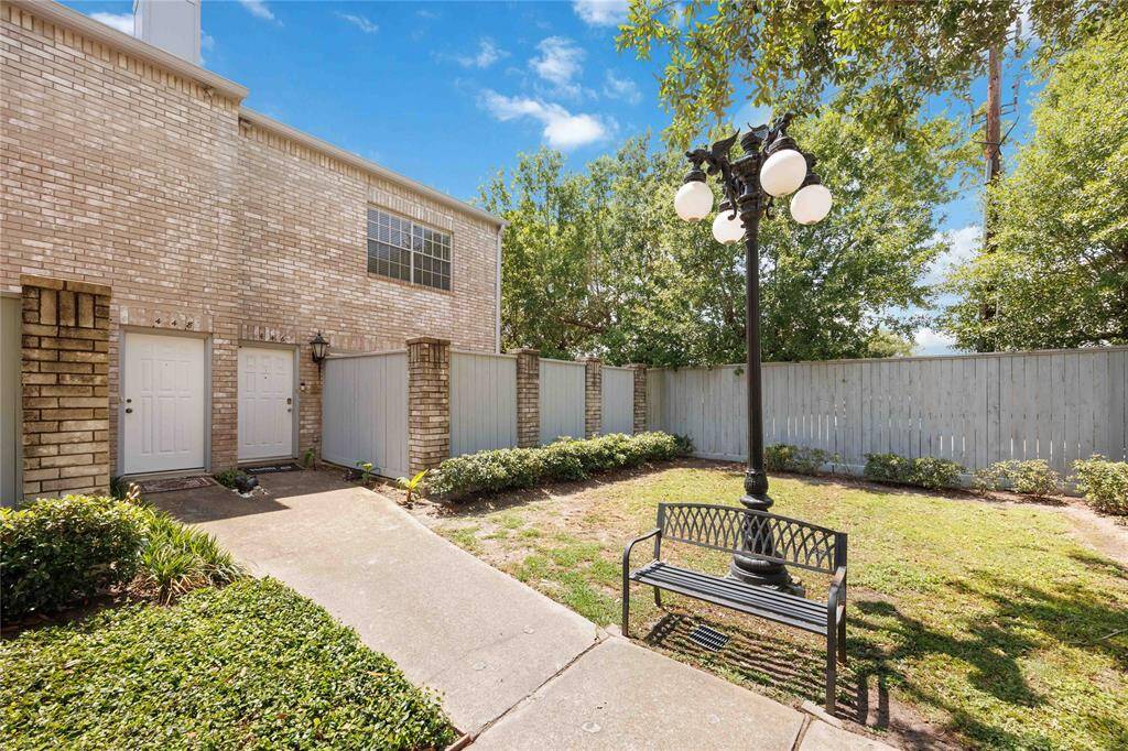 Pathway to unit entrance. Well-maintained community.
