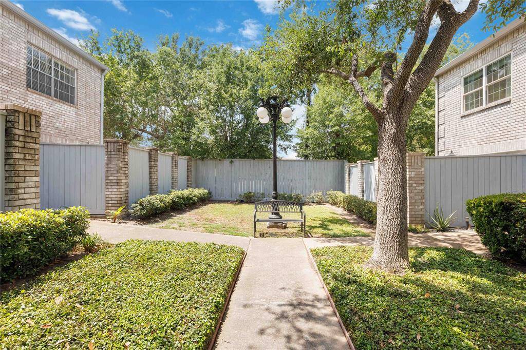 Pathway to unit entrance. Well-maintained community.