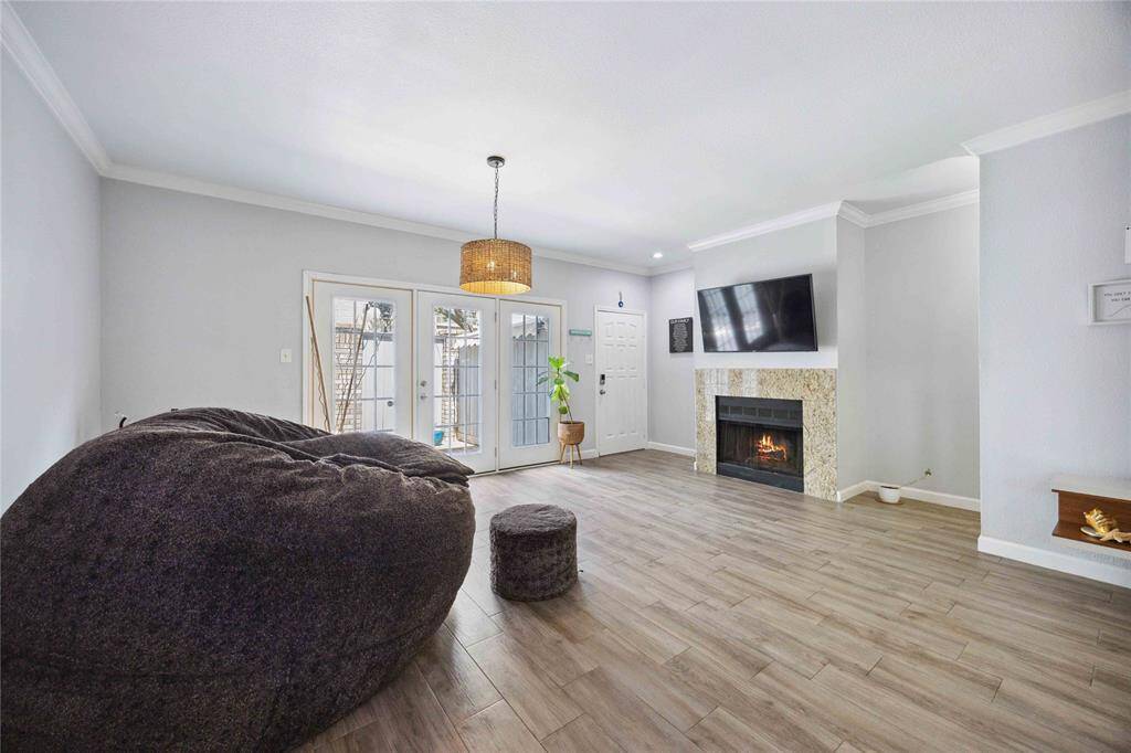 Spacious living/dining area with abundance of natural light.
