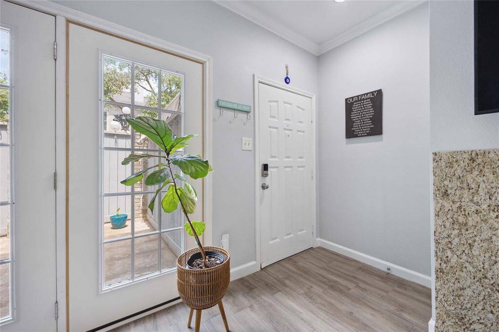 Townhome entrance and private patio access.