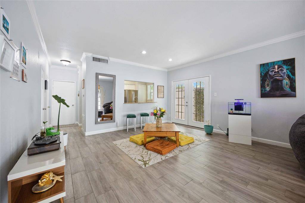 Spacious living/dining area with abundance of natural light.