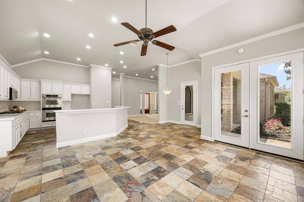 This angle looks back toward the Kitchen and Breakfast area, showcasing the grandeur of this open space.