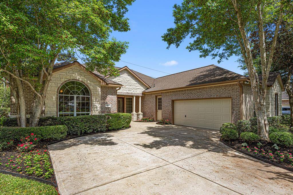 The gable roofline adds architectural charm, while mature trees provide ample shade and enhance the home’s natural beauty. An extended driveway lined with mature landscaping enhances the home’s inviting curb appeal and provides extra parking for guests.