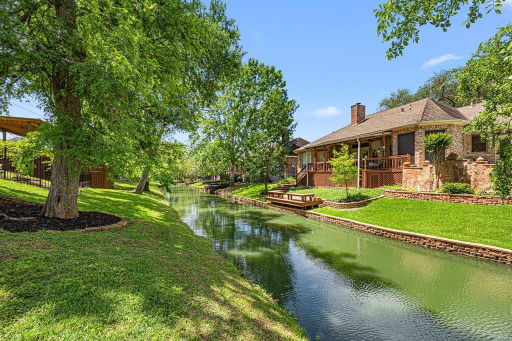 This view looks down Pecan Lake, showcasing the distance between homes and the tranquil, expansive surroundings.