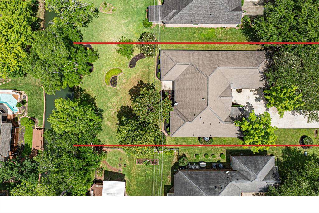 Looking straight down on the property, you can see the full layout, all the trees, and the beautiful surroundings. The property lines are highlighted in red, though not exact, giving a general sense of the boundaries.