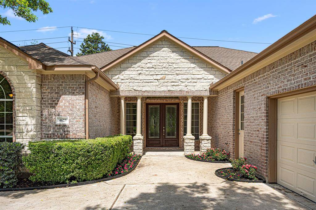 As guests make their way to the front entrance, they’re welcomed by a covered Front Porch with 4- stone columns, a double front door with glass insets, and windows on each side that invite in natural light.