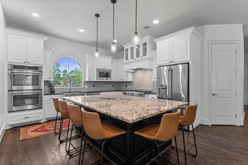 Oversized island, stainless steel appliances, fresh paint and plenty of cabinets!