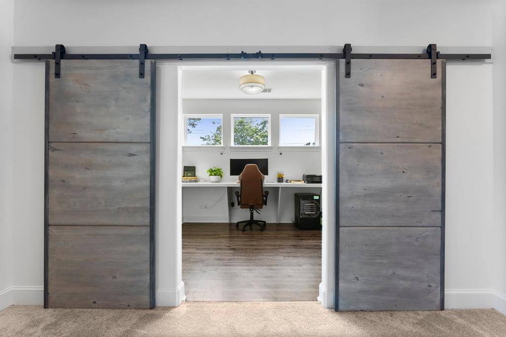 Off the upstairs living area is a bonus space currently being used as an office.