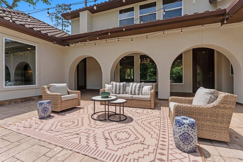 Additional seating and entertaining space are waiting for you in this majestic backyard oasis.