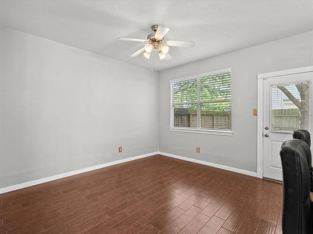 Living area opens to spacious back yard and patio. Large windows provide lots of natural light.