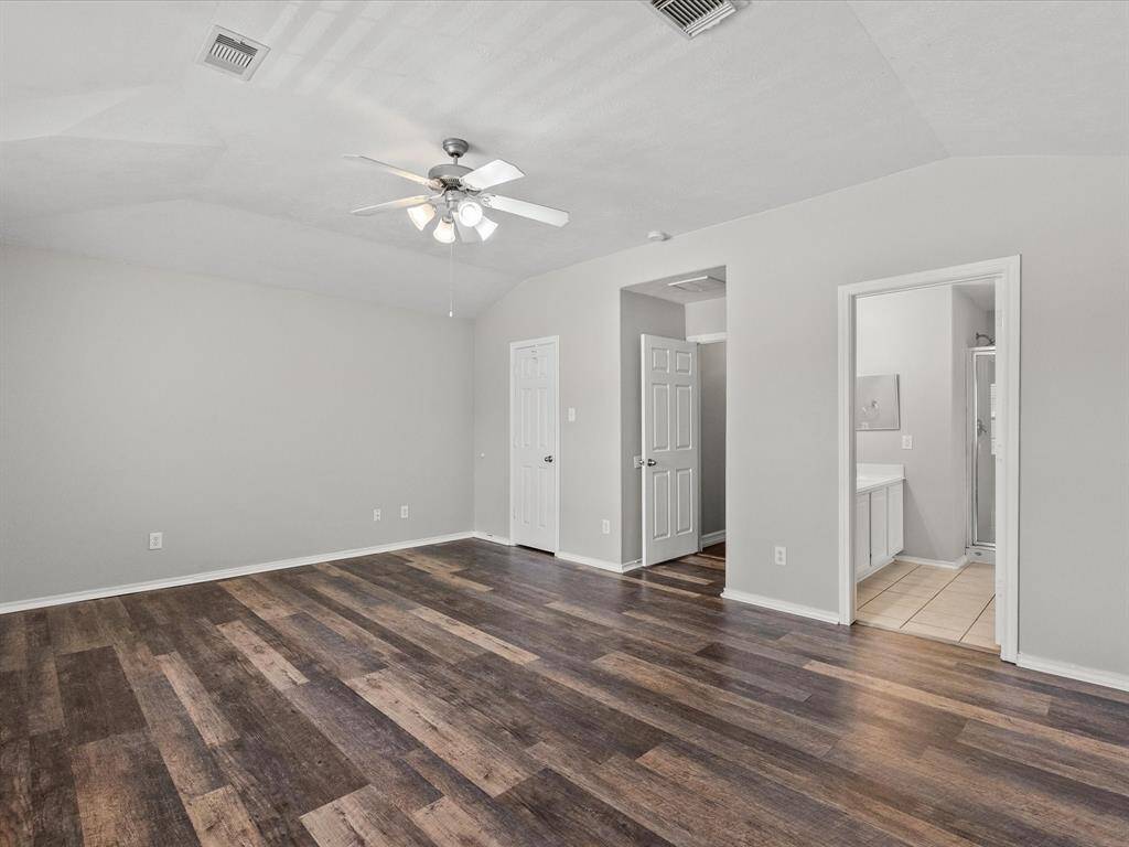 Primary bedroom has lots of extras, wood like vinyl flooring, adjoining en-suite full bath.