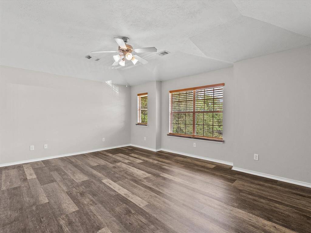 Primary bedroom is large and spacious with large windows.