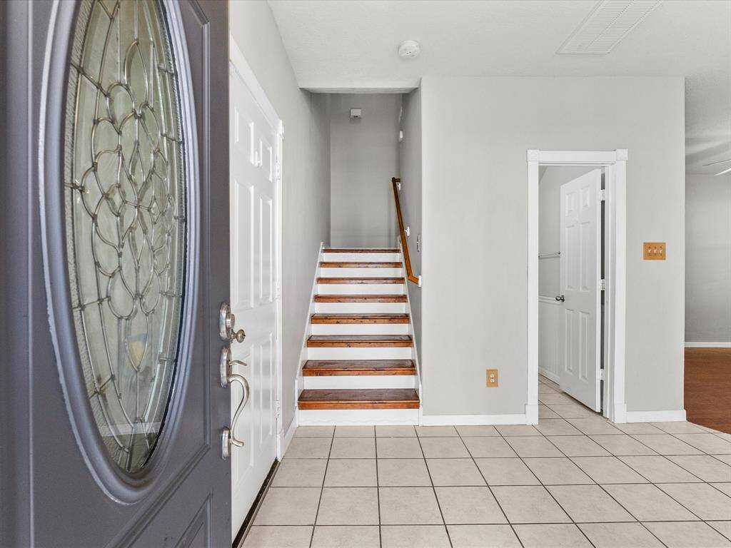 Entrance opens to an open concept floor plan and recent added wooded stair -case to second floor.