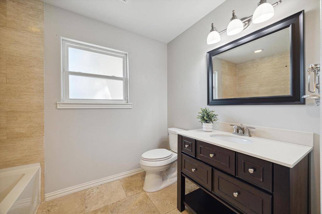 SECONDARY BATHROOM- Updated hall bathroom offers a shower/tub combo.