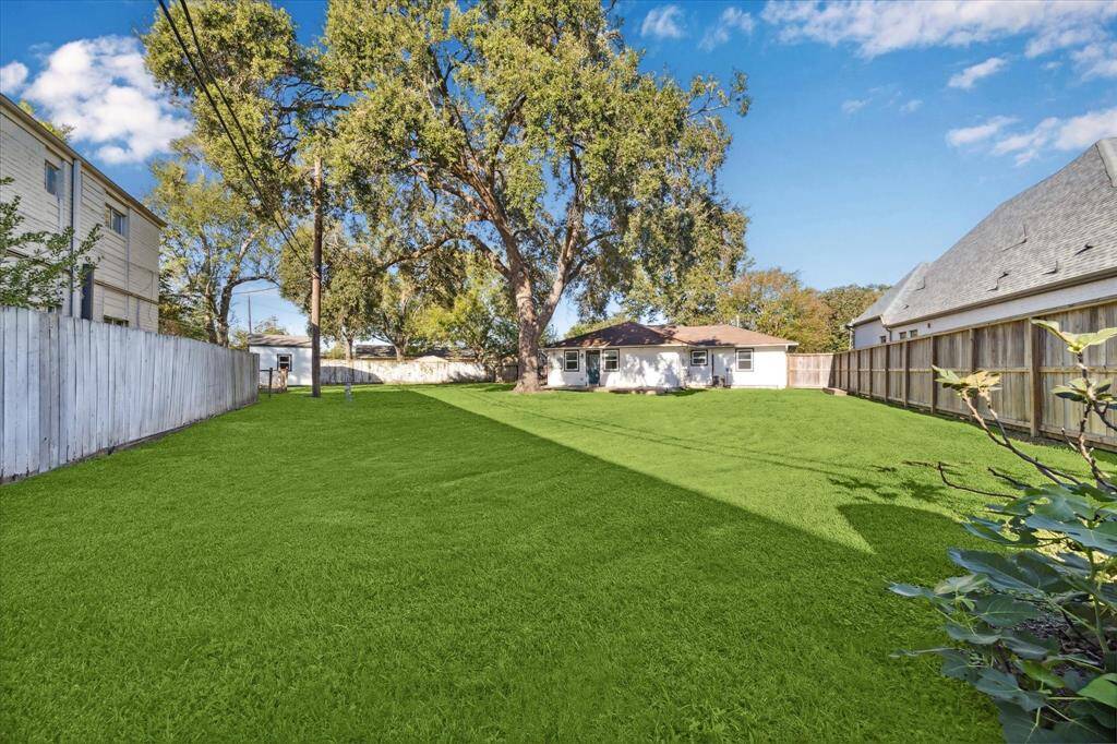 BACKYARD- Another view of the yard. Over 14,000 square feet to call your own.