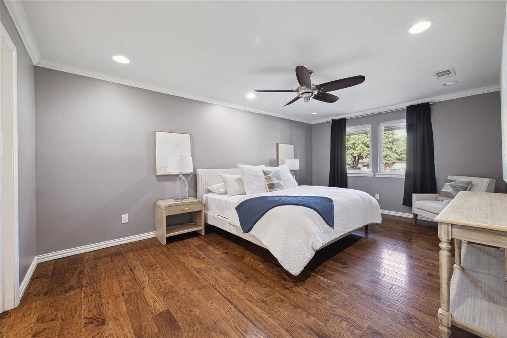 PRIMARY BEDROOM- Primary bedroom is very spacious as you can see a king bed can easily fit with room to spare. hardwoods throughout most of the home.