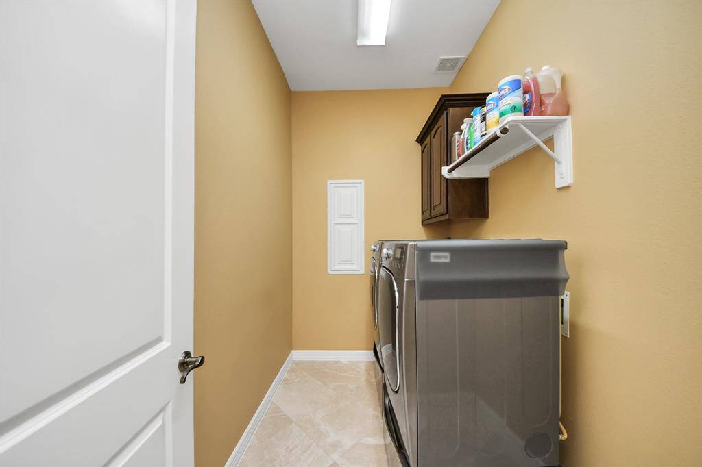 Utility room is located close to the 2 car garage